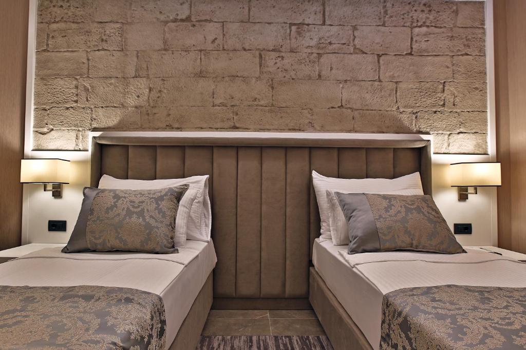 Postel nebo postele na pokoji v ubytování Mardin Airport hotel