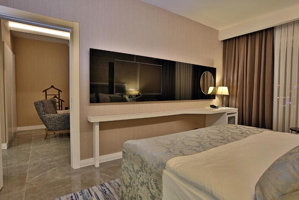 Postel nebo postele na pokoji v ubytování Mardin Airport hotel