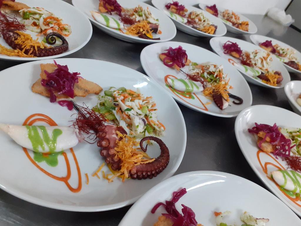 a bunch of plates of food on a table at Luna Convento Copanello B&B in Stalettì