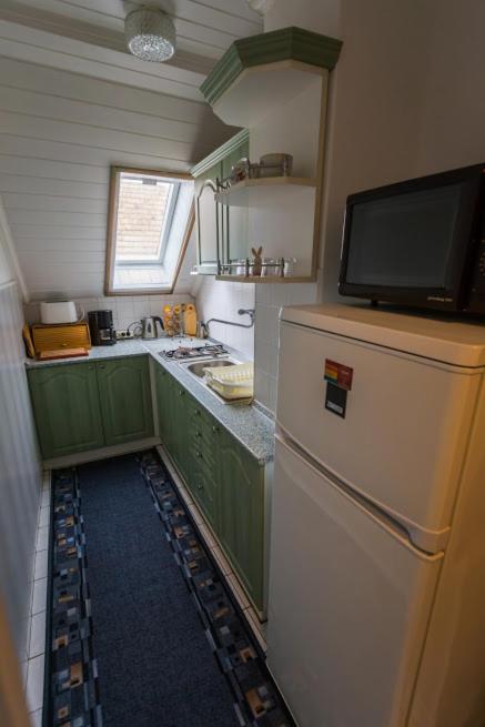 Kuchyň nebo kuchyňský kout v ubytování Joli Guesthouse