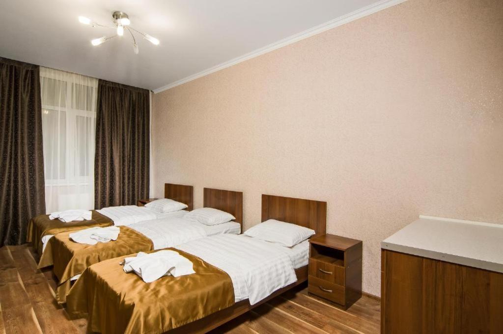 Postel nebo postele na pokoji v ubytování Lukyanovsky