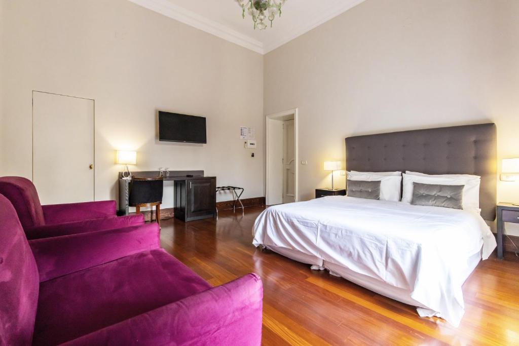 A bed or beds in a room at Gramsci Suites