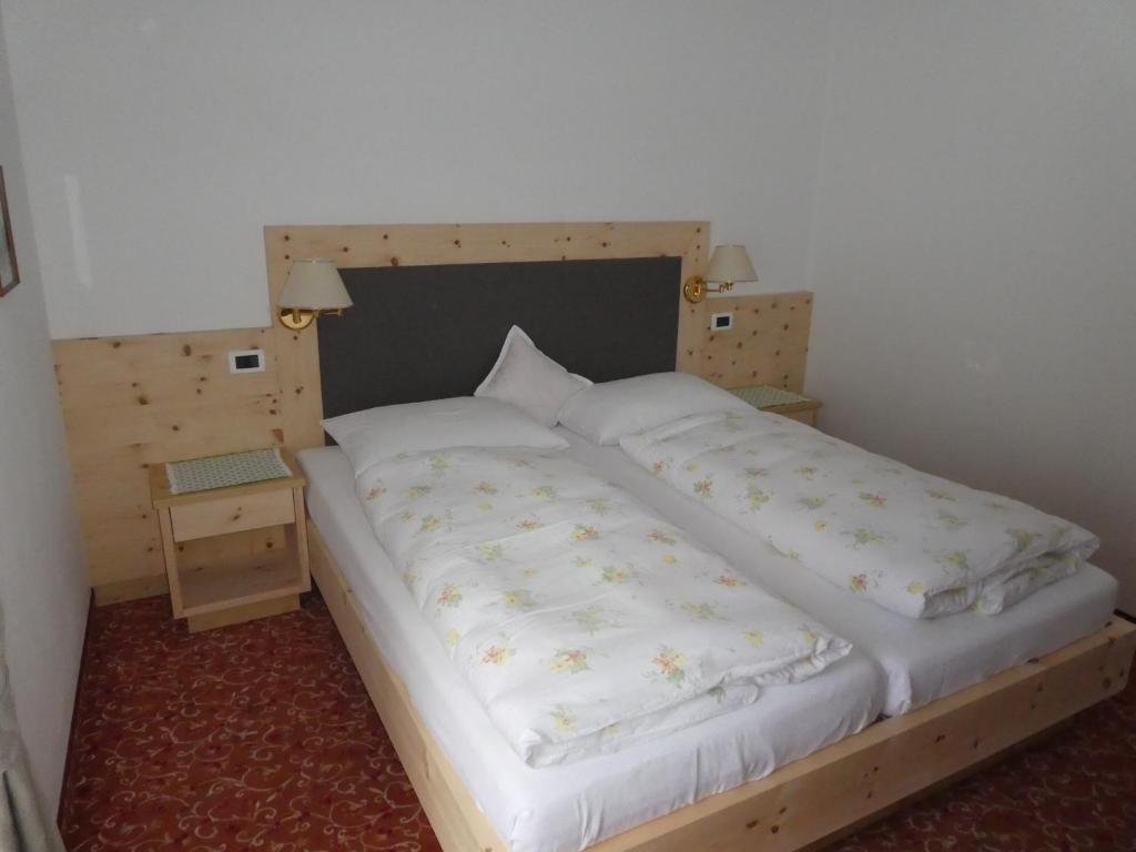 Postel nebo postele na pokoji v ubytování Garni Flurida