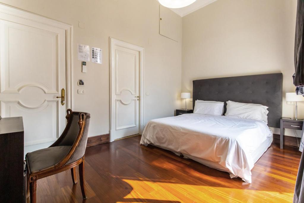 A bed or beds in a room at Gramsci Suites