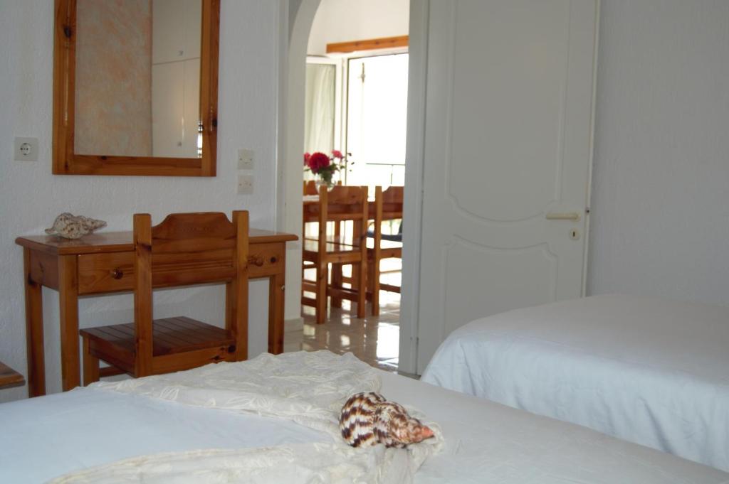 Postel nebo postele na pokoji v ubytování Odyssia Apartments