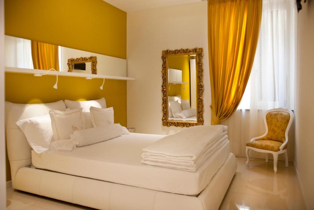 Postel nebo postele na pokoji v ubytování Opera Relais De Charme - Aparthotel