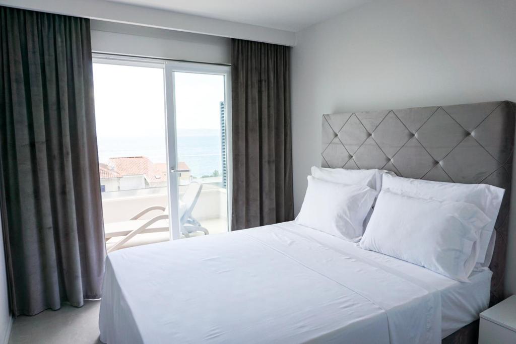 Posteľ alebo postele v izbe v ubytovaní SoL Rooftop Apartments