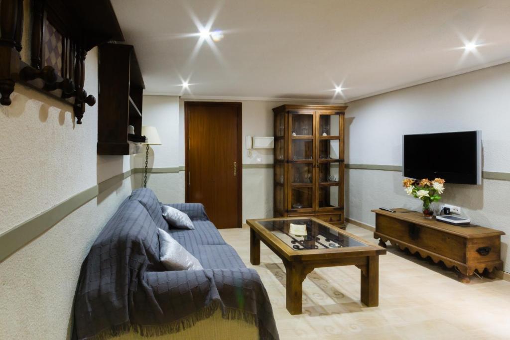 a living room with a couch and a coffee table at PORTA NOVA´S HOME in Córdoba