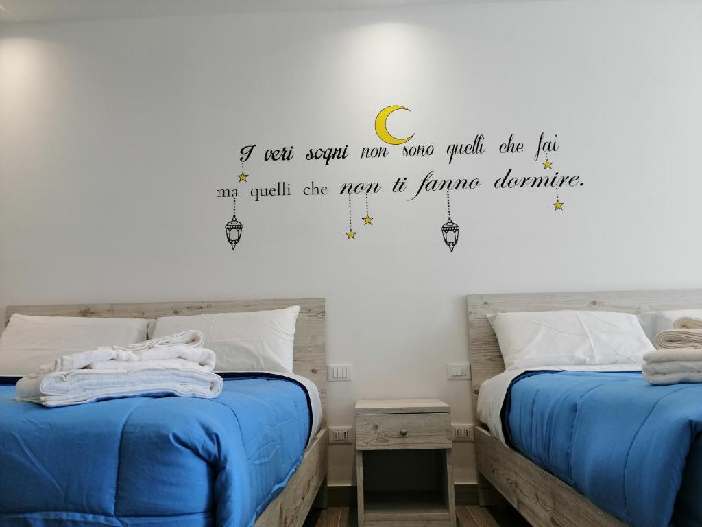 Postel nebo postele na pokoji v ubytování Sicily Rooms Appartamenti
