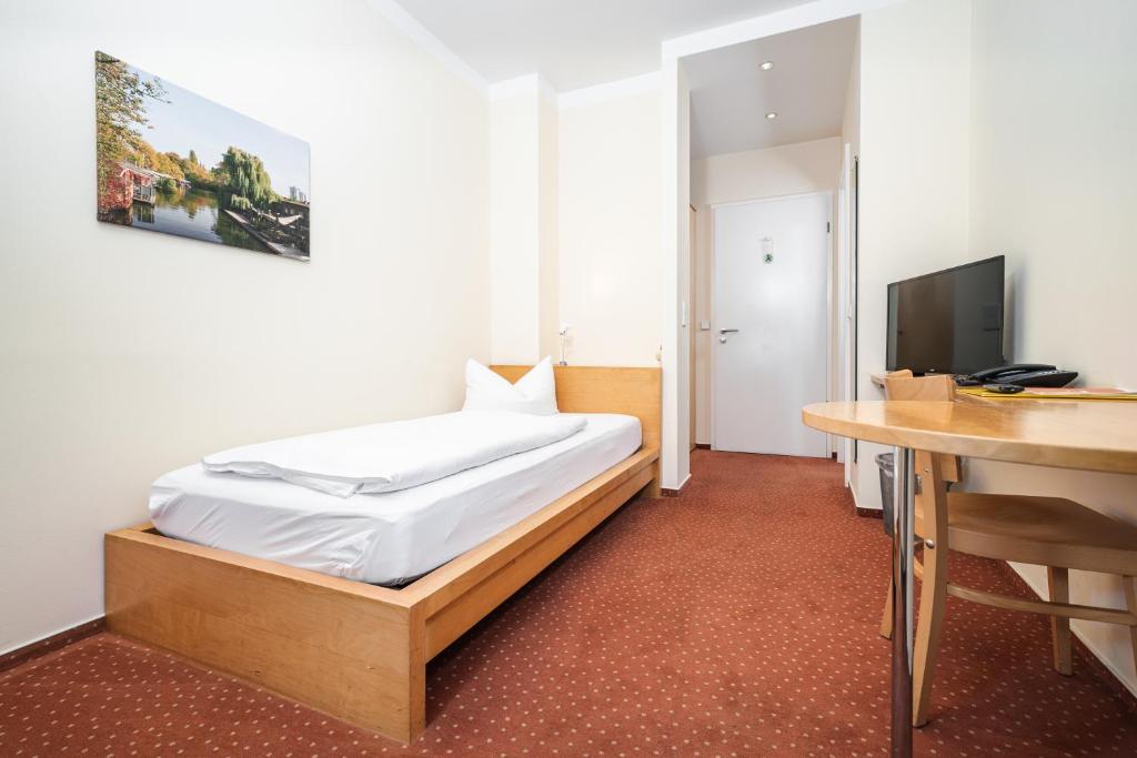 Postel nebo postele na pokoji v ubytování Hotel 26