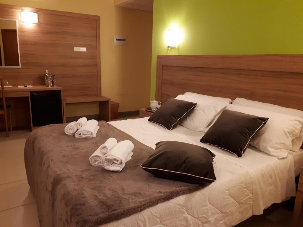 Postel nebo postele na pokoji v ubytování Hotel La Ninfea