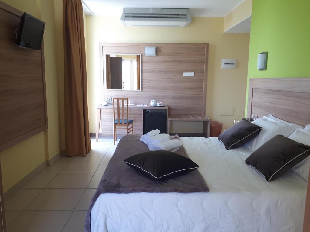 Postel nebo postele na pokoji v ubytování Hotel La Ninfea