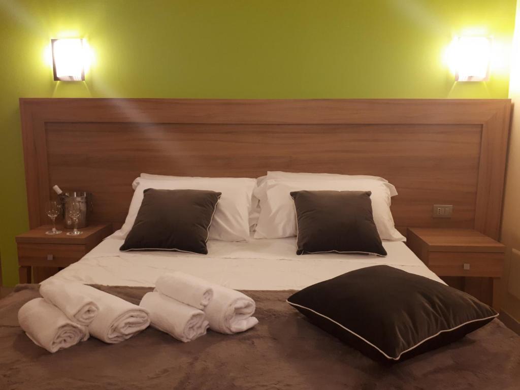 Postel nebo postele na pokoji v ubytování Hotel La Ninfea