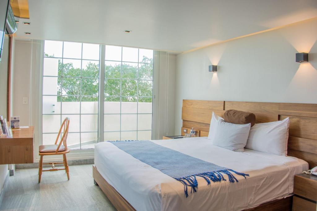 Cama ou camas em um quarto em Hotel Plaza Kokai Cancún