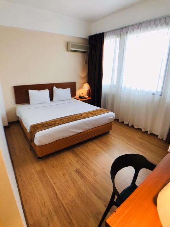 Postel nebo postele na pokoji v ubytování Kawan Hotel