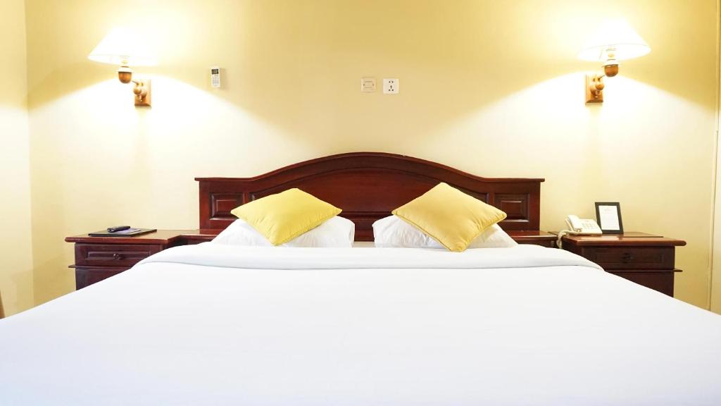 Postel nebo postele na pokoji v ubytování Masainn Hotel Kuta