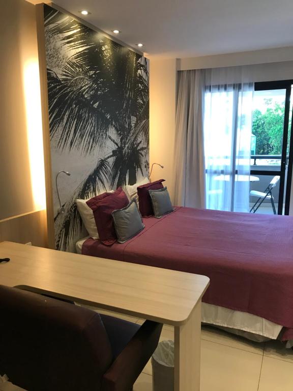 Postel nebo postele na pokoji v ubytování Boulevard Residencial