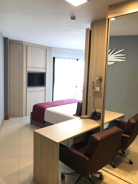 TV a/nebo společenská místnost v ubytování Boulevard Residencial