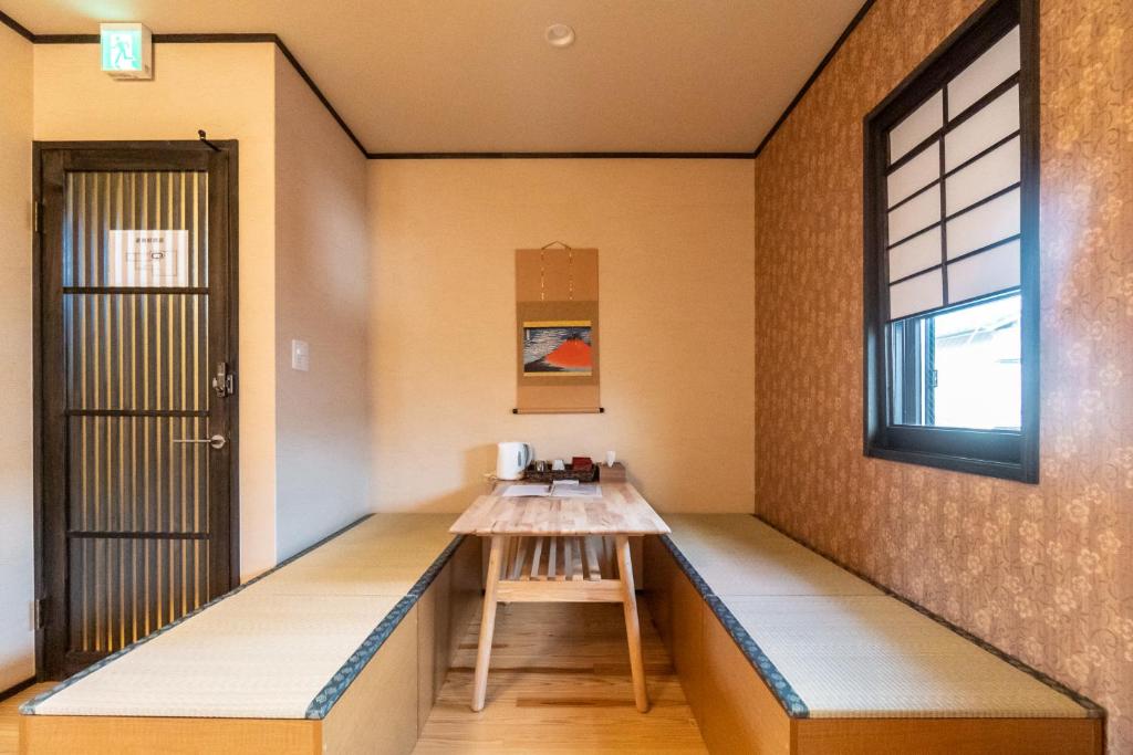 Postel nebo postele na pokoji v ubytování Étoile Shijo Omiya