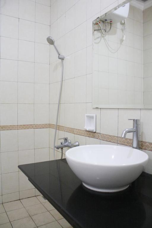 Koupelna v ubytování HOTEL & WISMA BINTANG JADAYAT