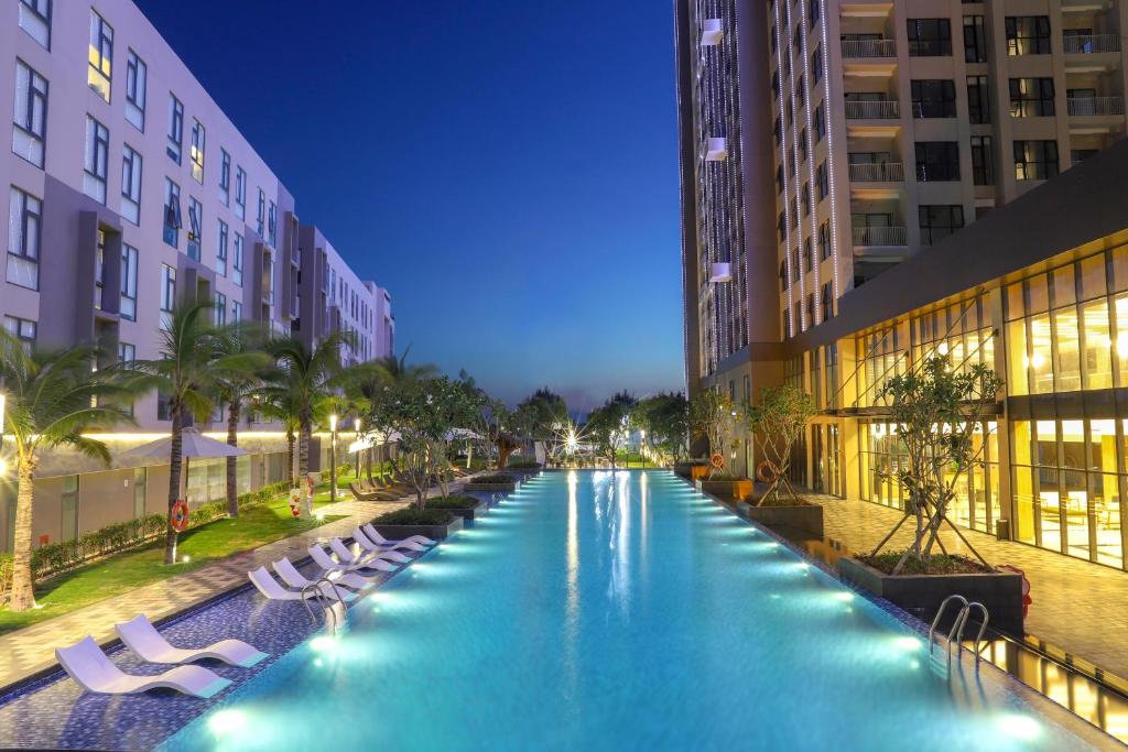 a swimming pool in the middle of a building at Carinae Danang Hotel in Danang