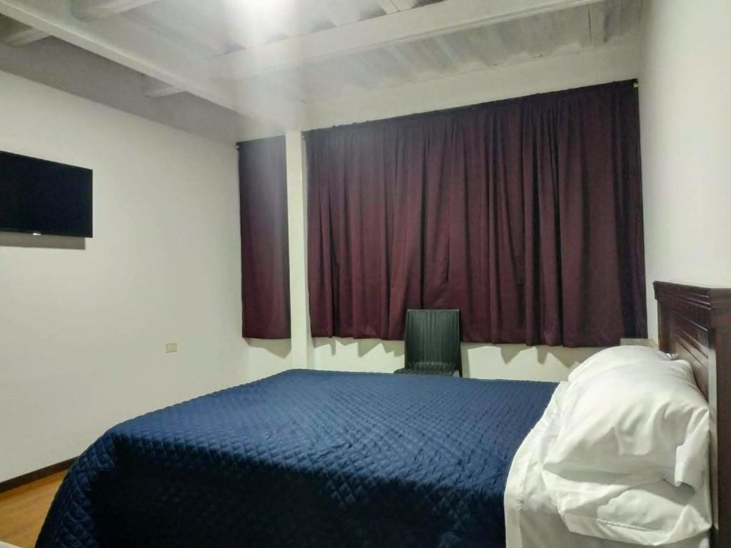 Postel nebo postele na pokoji v ubytování Habitaciones Alkimya