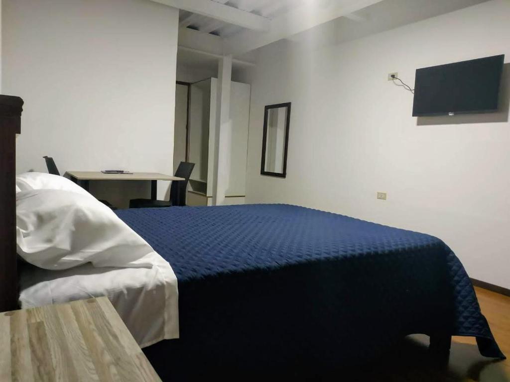 Postel nebo postele na pokoji v ubytování Habitaciones Alkimya