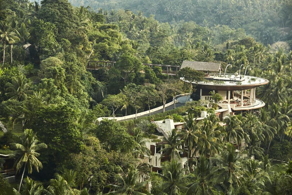 a building in the middle of the forest at Four Seasons Resort Bali at Sayan in Ubud