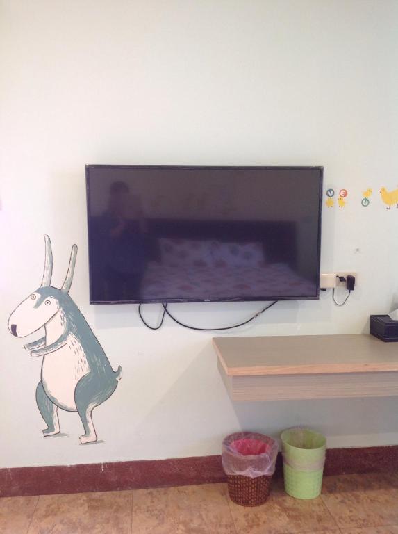 TV a/nebo společenská místnost v ubytování Backstreet Inn