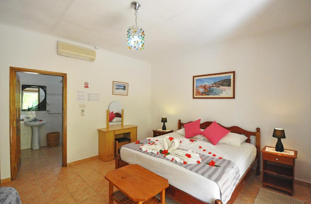 Postel nebo postele na pokoji v ubytování Acquario Guesthouse
