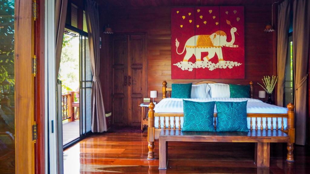 Postel nebo postele na pokoji v ubytování Rommai Villa Chiang Rai