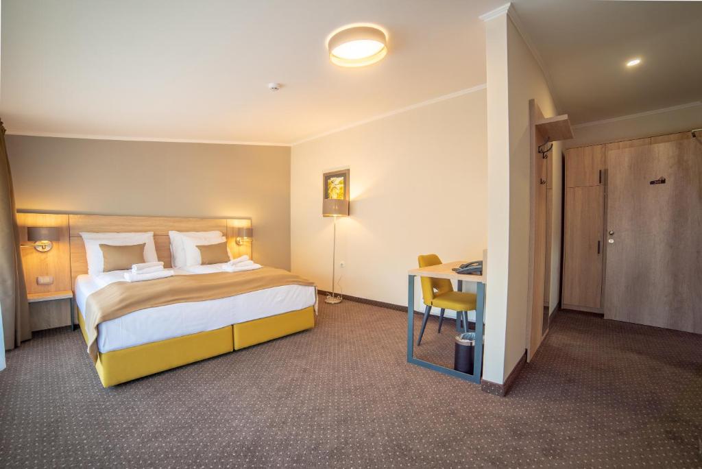 Postel nebo postele na pokoji v ubytování Hotel Soni Lux