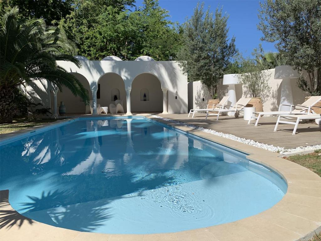 Πισίνα στο ή κοντά στο Villa L'Heure Bleue avec piscine proche plage