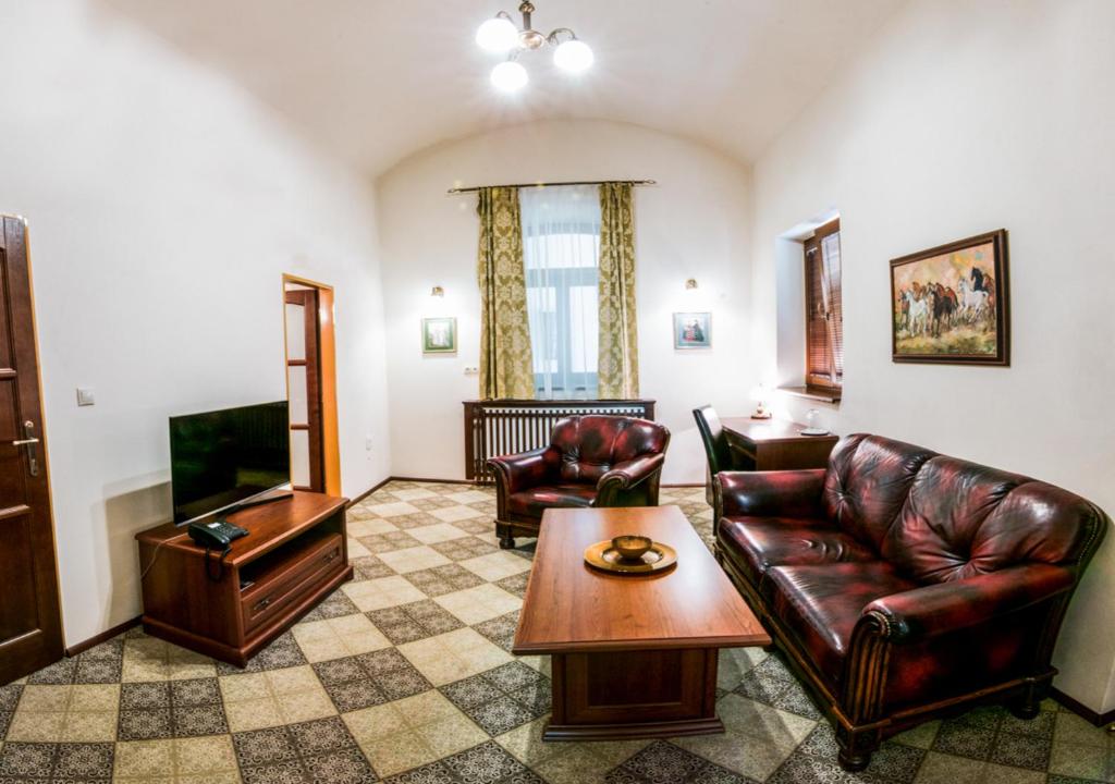 TV a/nebo společenská místnost v ubytování Pension Horse Inn