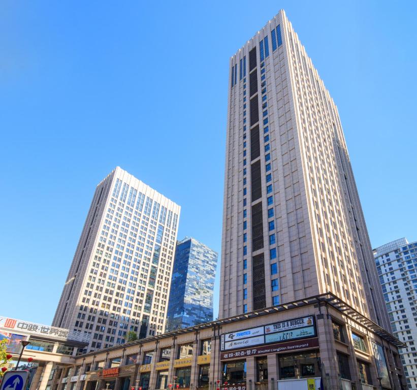 a group of tall buildings in a city at The Palace Service Apartment Beijing in Beijing