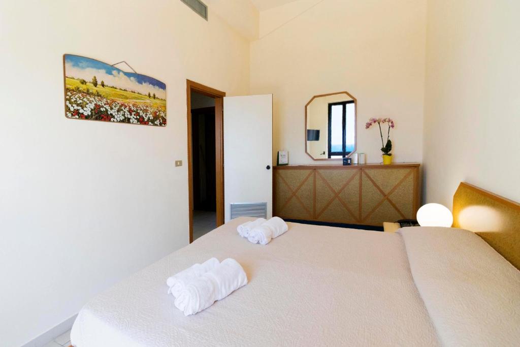 Postel nebo postele na pokoji v ubytování Albergo Palazzo