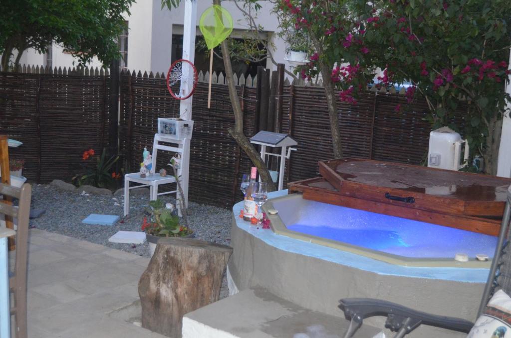 a backyard with a hot tub in a yard at Bougain Villa Self-catering ,Darling in Darling