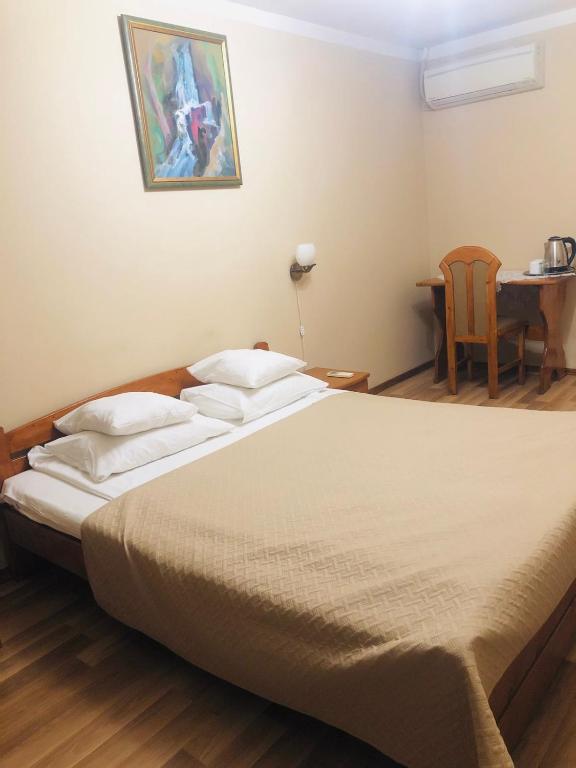 Postel nebo postele na pokoji v ubytování Atlant Hotel