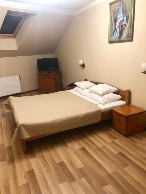 Postel nebo postele na pokoji v ubytování Atlant Hotel