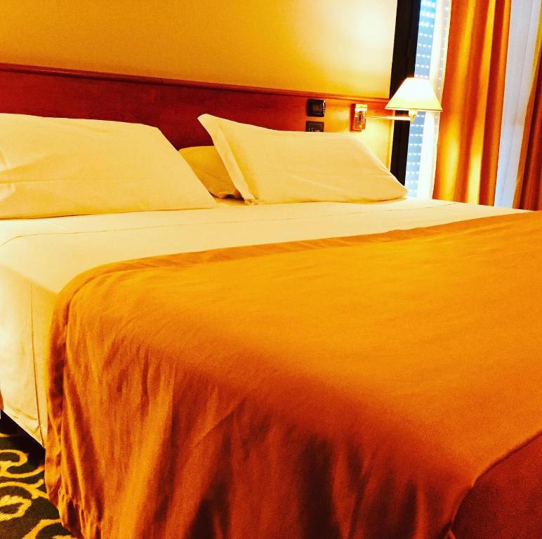 Posteľ alebo postele v izbe v ubytovaní Hotel Motel Europa