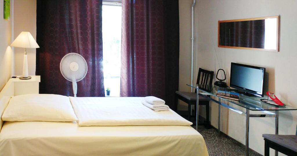 TV a/nebo společenská místnost v ubytování Hotel M68