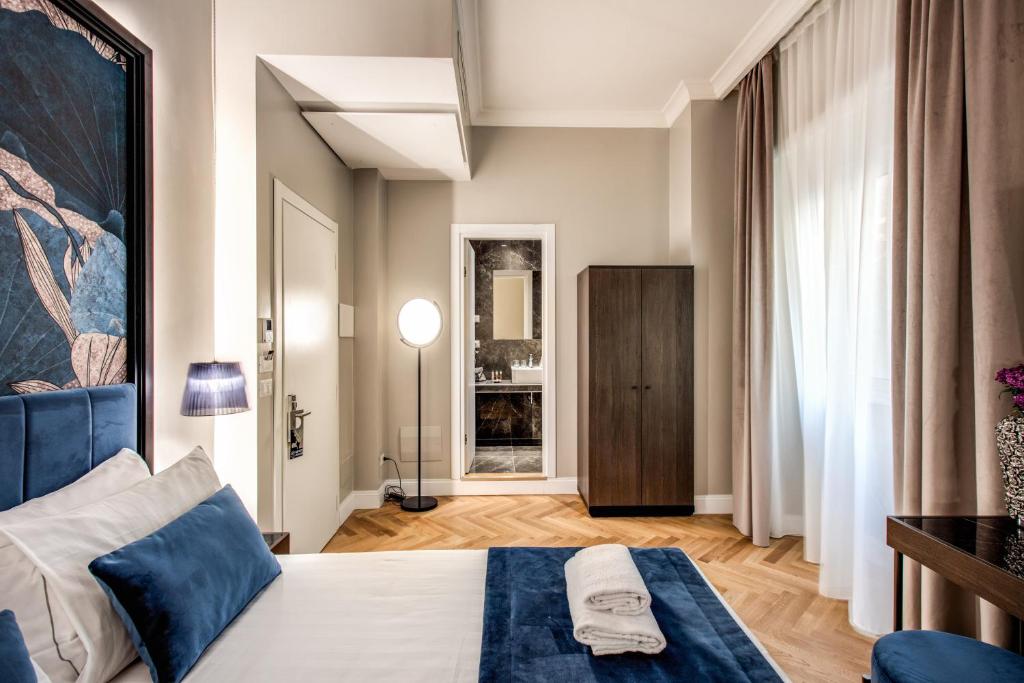 Postel nebo postele na pokoji v ubytování Hotel 55 Fifty-Five - Maison d'Art Collection