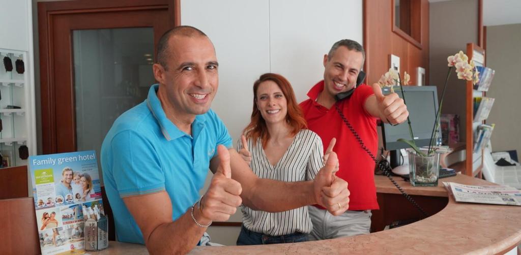 a group of three people giving the thumbs up at Hotel San Salvador in Bellaria-Igea Marina