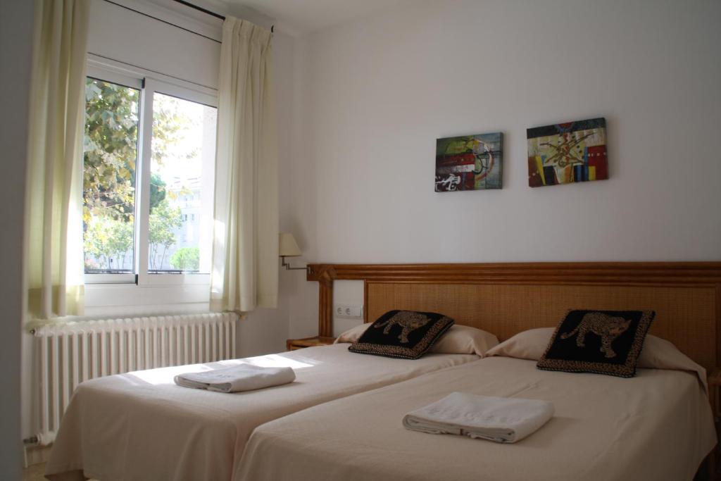 Postel nebo postele na pokoji v ubytování Apartaments Margarita Sabina Pinell