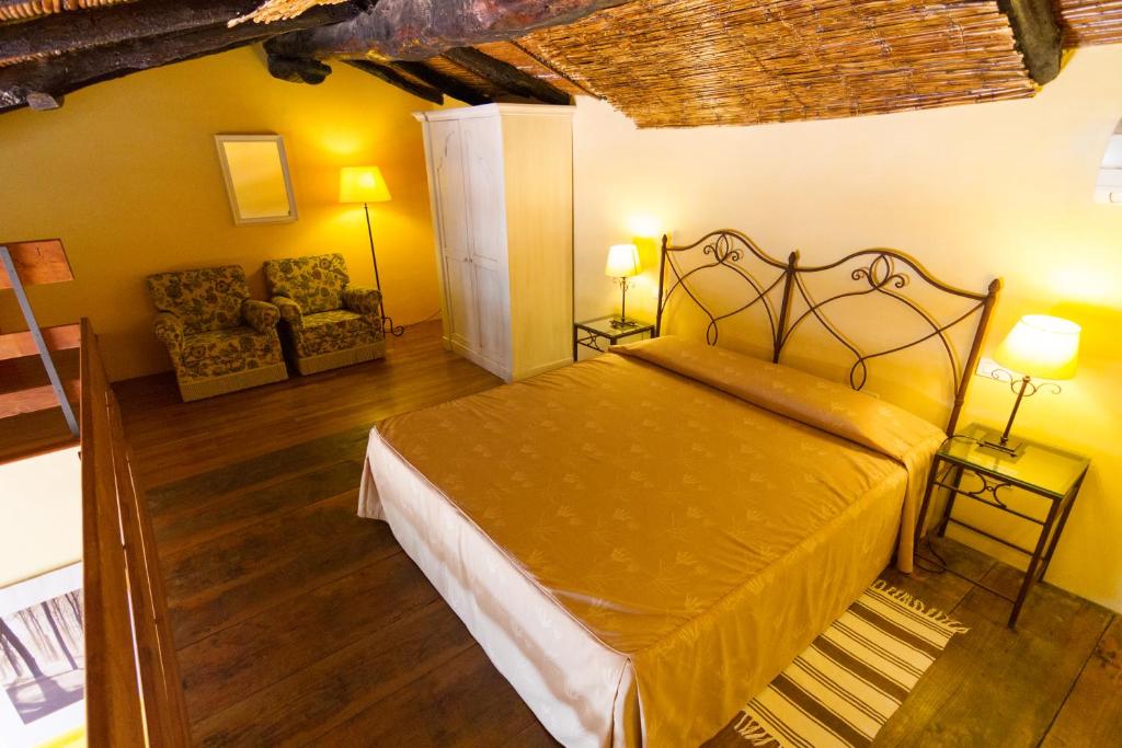 Postel nebo postele na pokoji v ubytování Etna Hotel