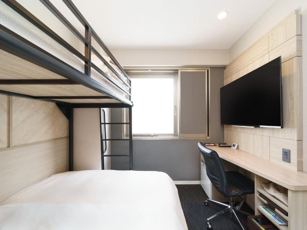 TV a/nebo společenská místnost v ubytování Super Hotel Umeda Higobashi