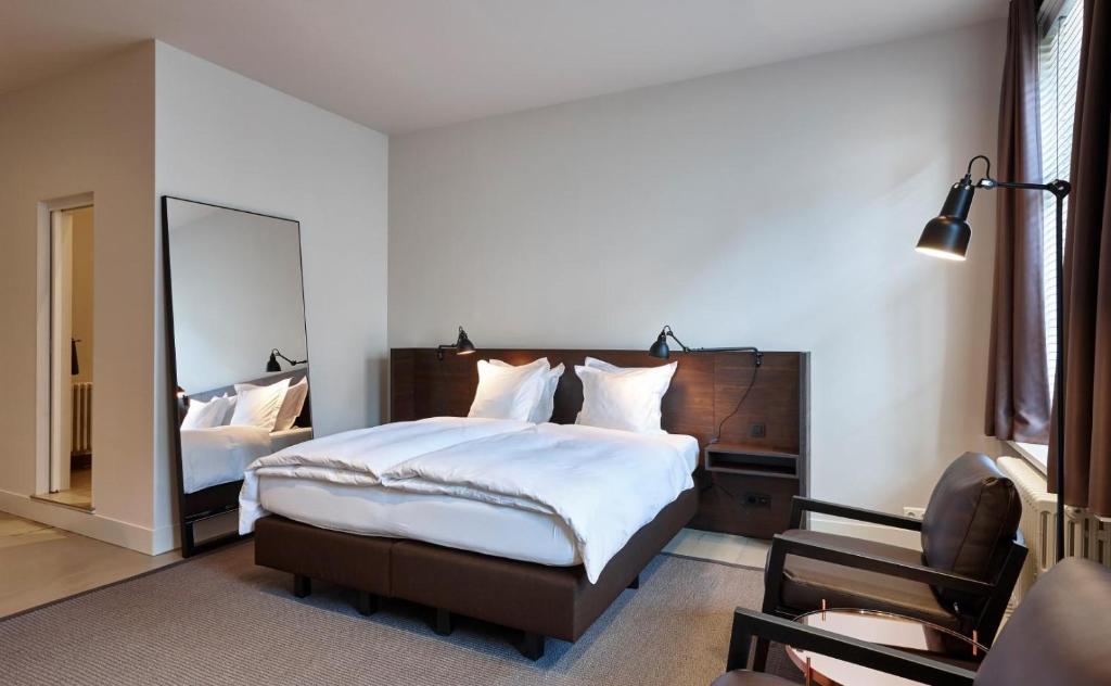 Un pat sau paturi într-o cameră la Sint Jacobs