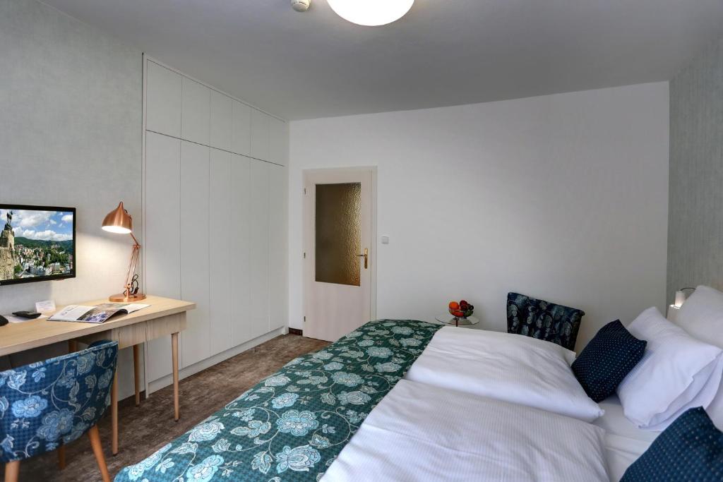 Postel nebo postele na pokoji v ubytování ASTORIA Hotel & Medical Spa