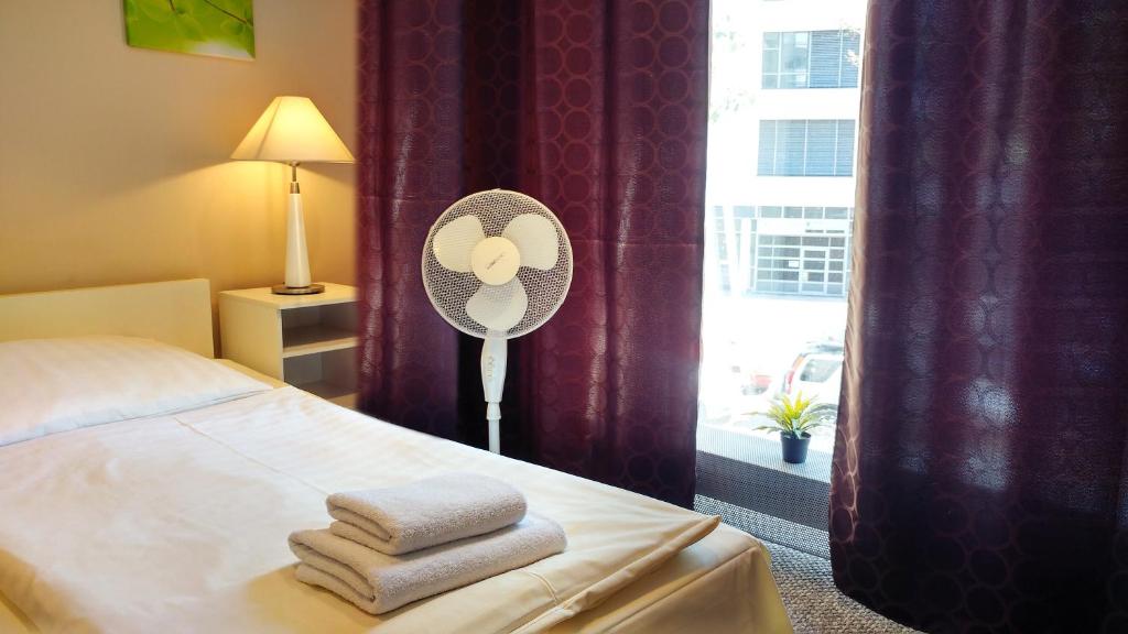 Postel nebo postele na pokoji v ubytování Hotel M68