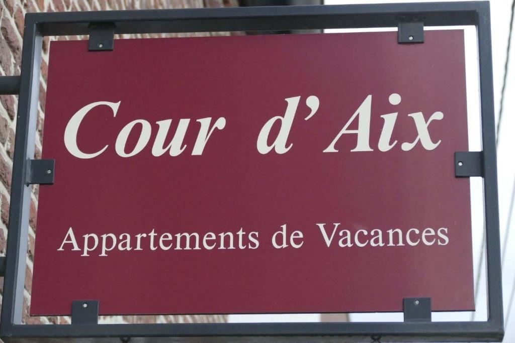 a red sign that reads our aix appliances departments de vases at Apartments Cour d'Aix in Richelle